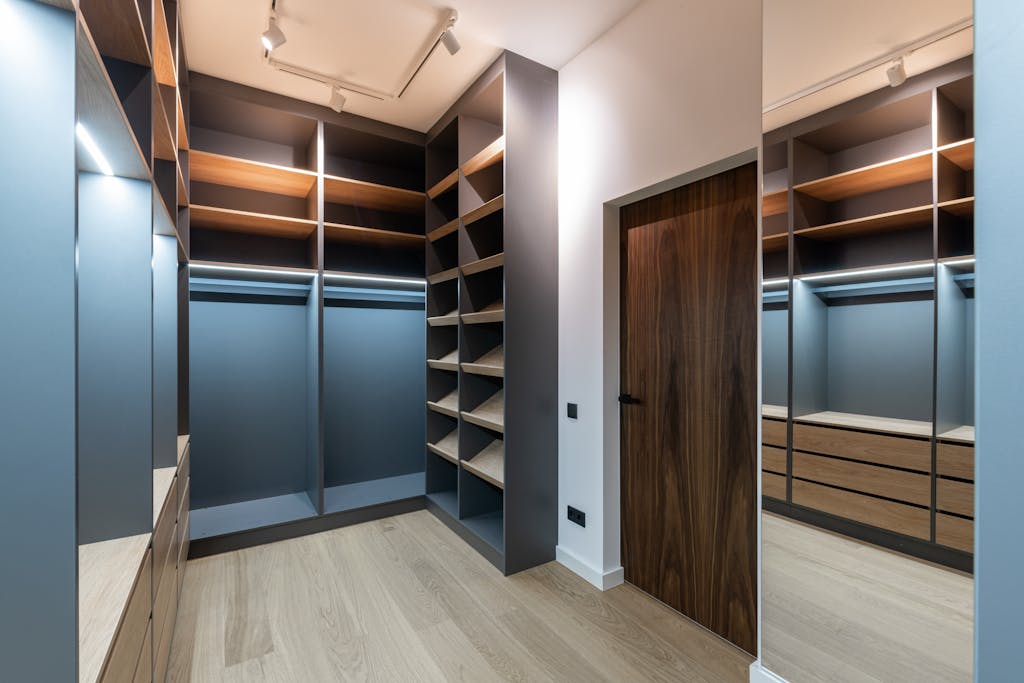 Wardrobe interior with shelves near door