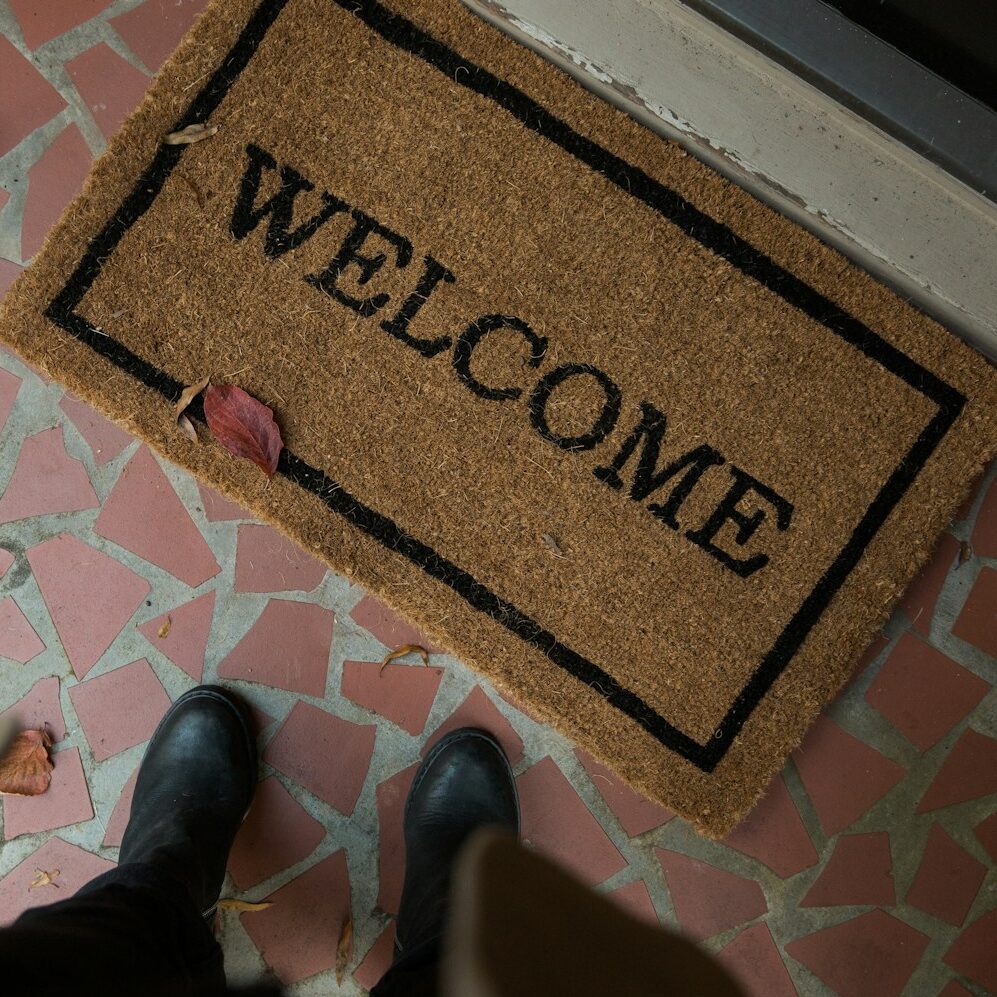 brown and beige welcome area rug